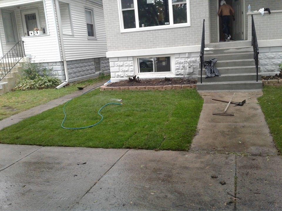 Freshly Laid Sod & Retaining Wall Before flowers w