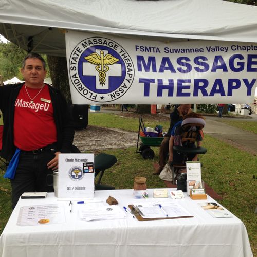 Providing Chair Massage at the Gainesville Art Fes