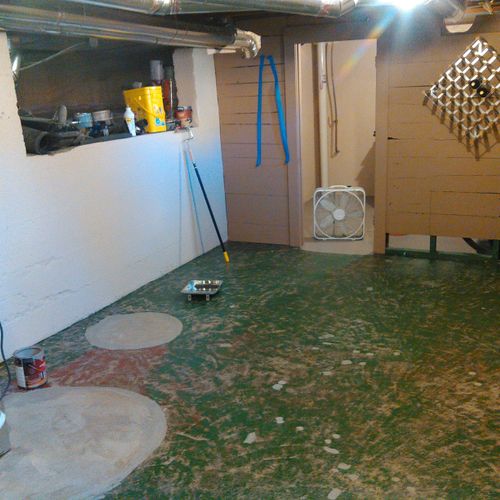 Basement floor, surface roughed by grinder