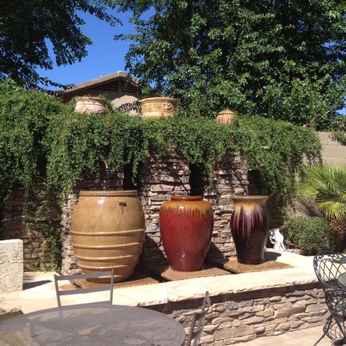 Water feature with veneer stone