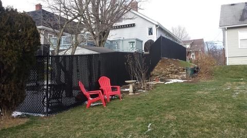 6' black vinyl coated chain link fence with steep 