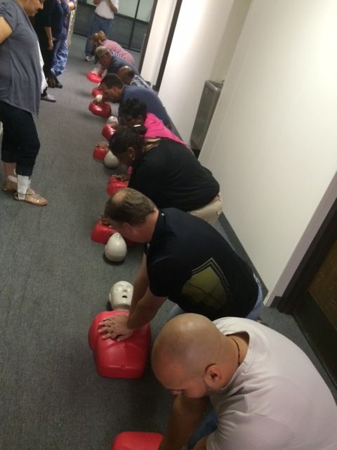 Teaching Adult CPR to workers at a body shop compa