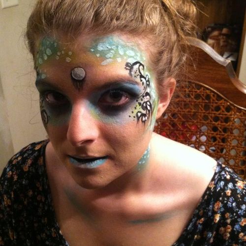 A mermaid painted for a Halloween party.