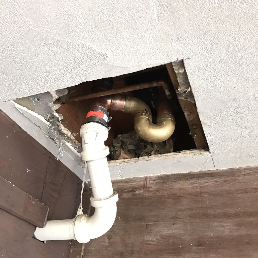Replacement  tub p-trap above car port in apartmen