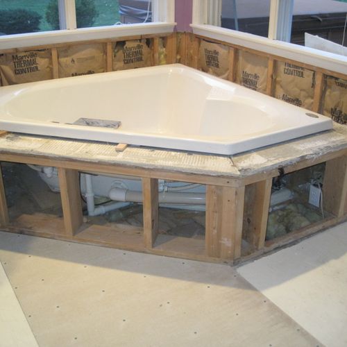 Installation of a whirl pool surround. Framed out,