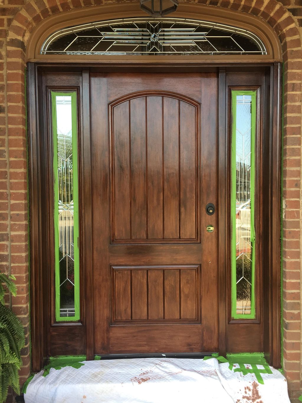 Finishing touches on refurbished door