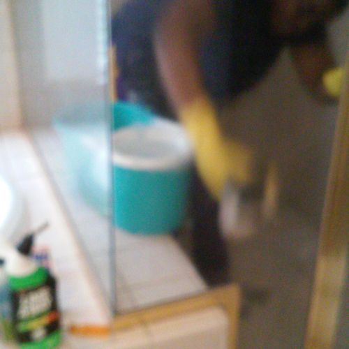 Cleaning hard water from shower door.