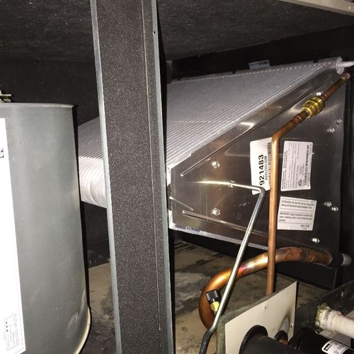 A/C indoor evaporator coil installation.