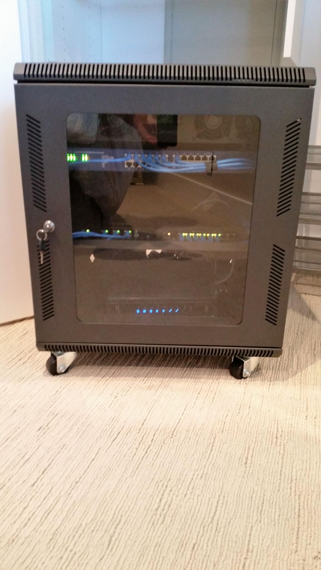 This is a server cabinet with all the home wifi eq