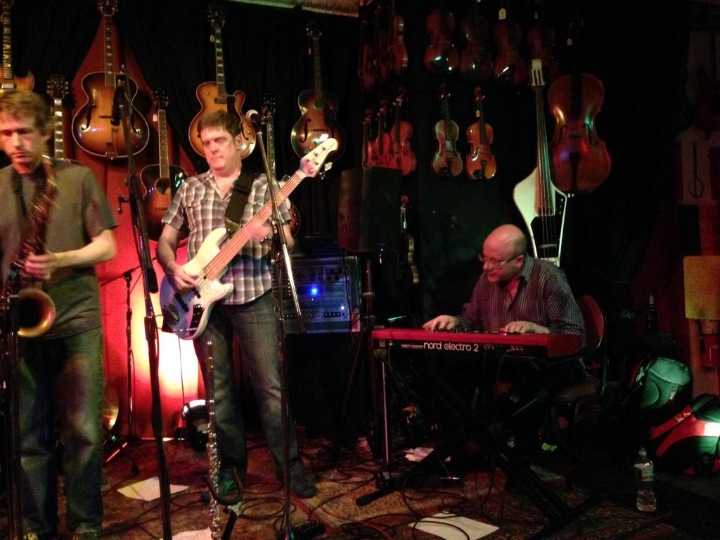 A performance of Dan's jazz-rock band at Luthier's
