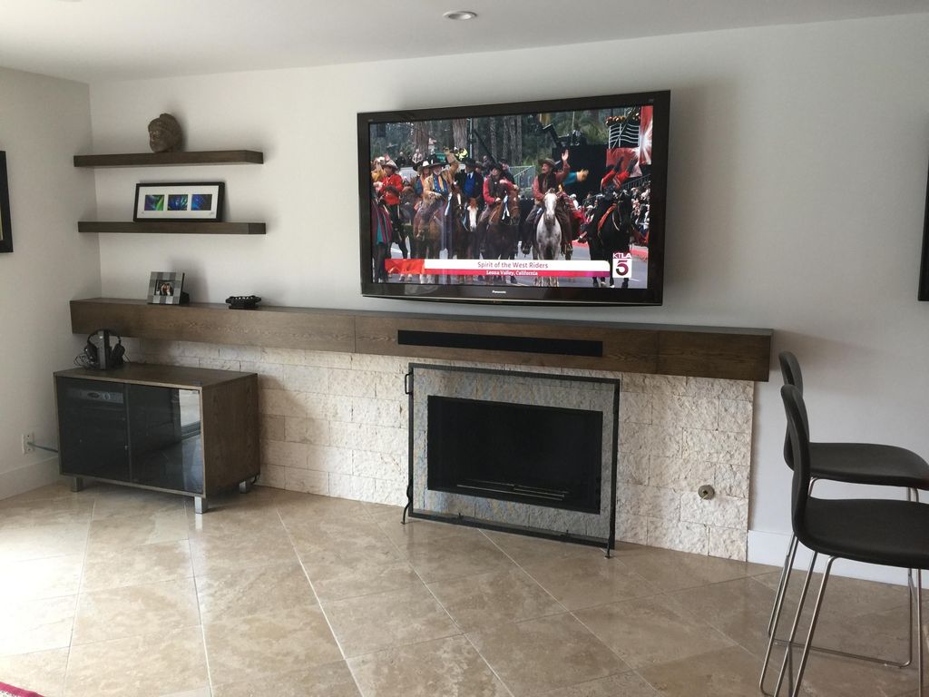Floating shelving, new stone on fireplace and cust