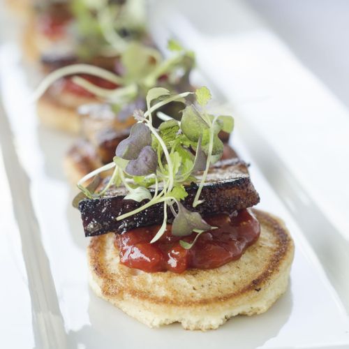 pork belly with corn meal blinis and tomato jam