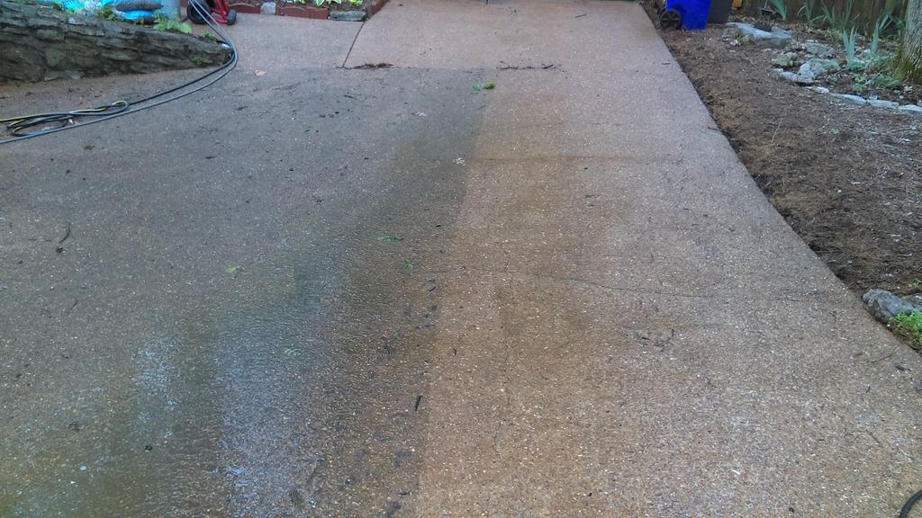 Washing a dirty driveway (during)