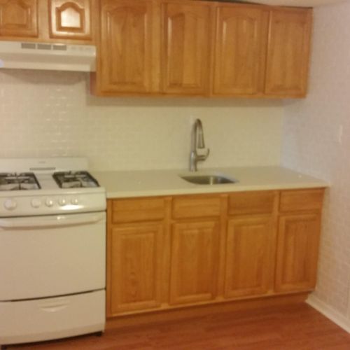New oak  kitchen cabinets with subway tile back sp