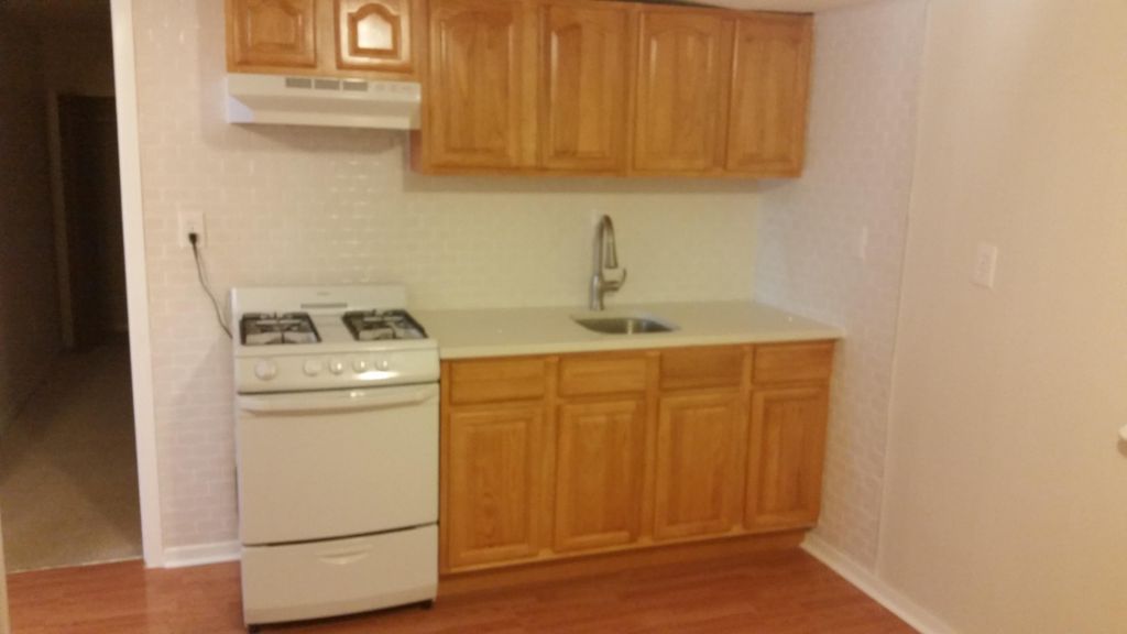 New oak  kitchen cabinets with subway tile back sp
