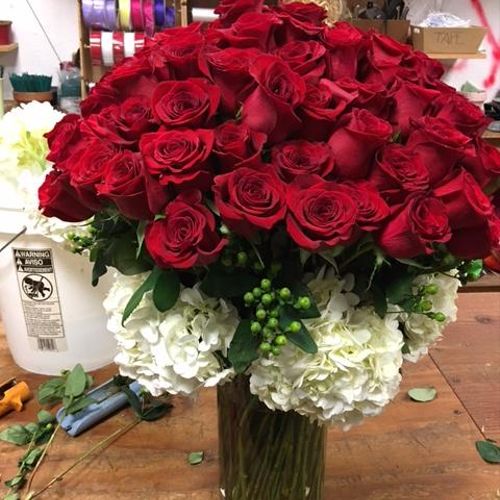 Custom order includes 7 dozen Red Roses, White Hyd