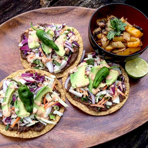 Tostadas with seasoned refried bean, cabbage slaw,
