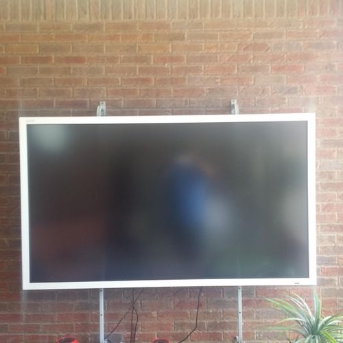 70 inch flat screen on customer mount on brick wal