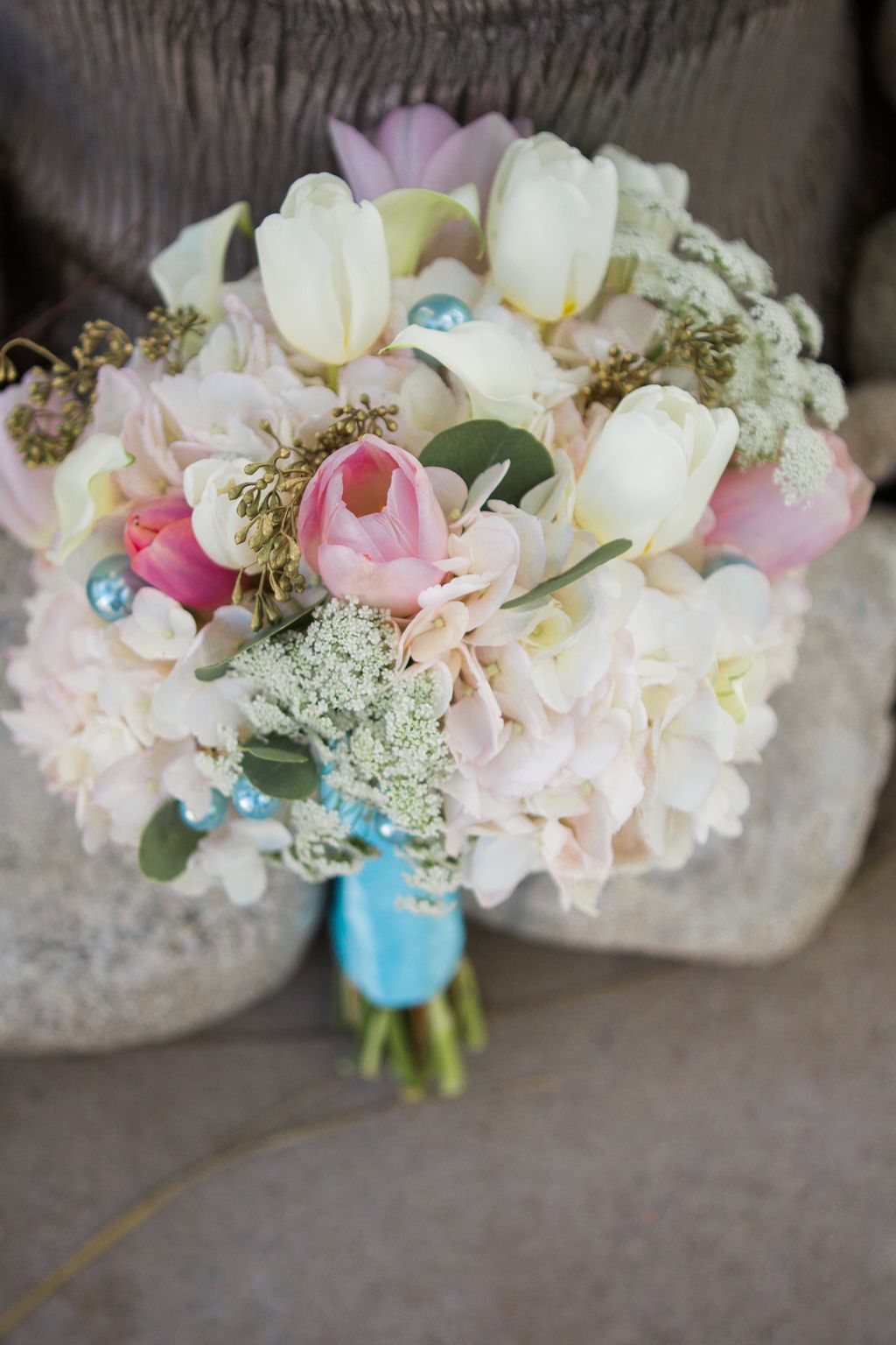 This bridal bouquet got an upgrade of blue pearls!