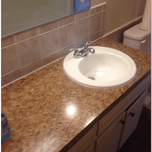 Tiled back splash, laminated vanity top and instal