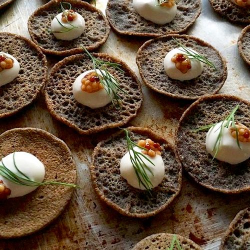 Buckwheat blini hors d'oeuvres for a baby shower.