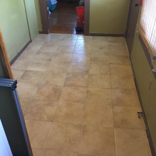 Tile floor remodel done in a laundry room. Pier an