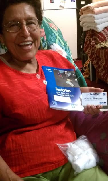 Proud student displaying her Certification Card, g