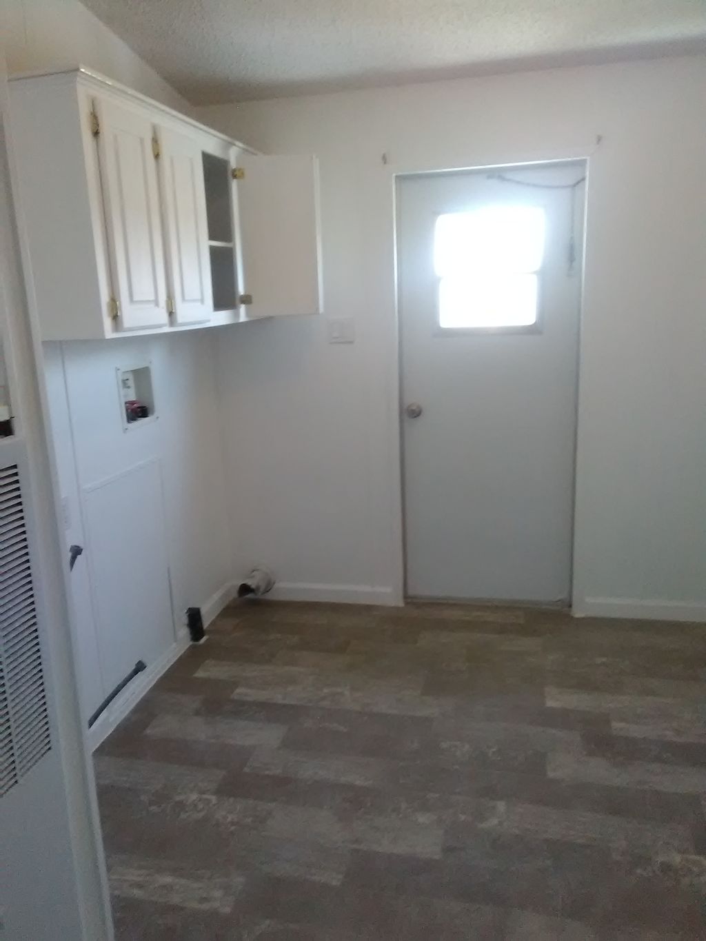 installed vinyl flooring, baseboard and painted   