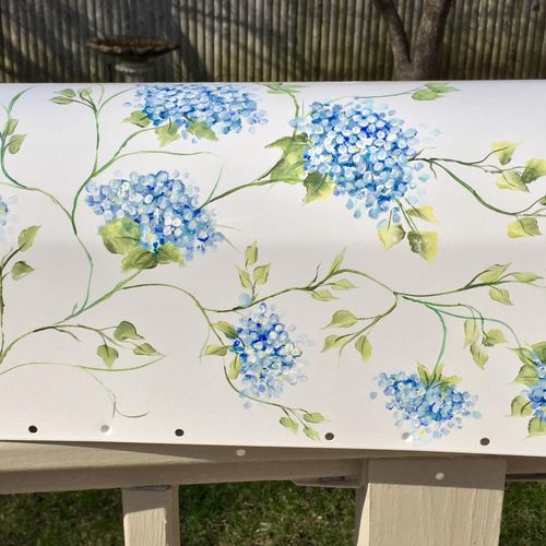 Hand painted blue floral mailbox.