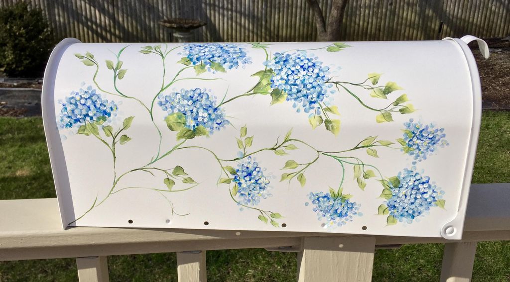 Hand painted blue floral mailbox.