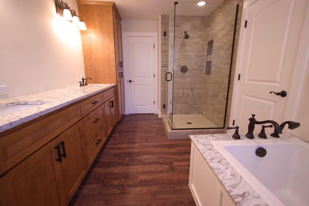On Suite with stained shaker cabinets and bath rem