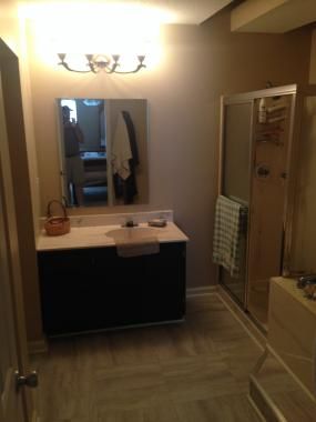 New Bathroom flooring, mirror, and vanity refinish