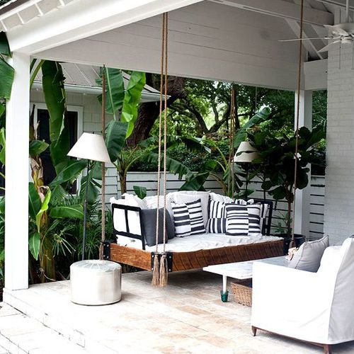 Loving this porch swing -- it gives the porch an u