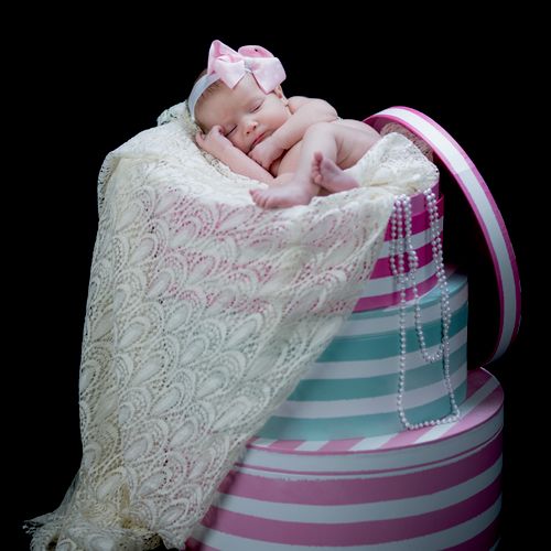 newborn picture in hat box