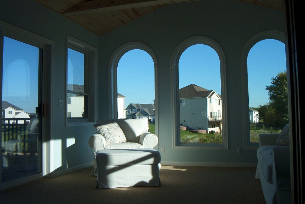 Patio door and Arched top windows. Elegant !