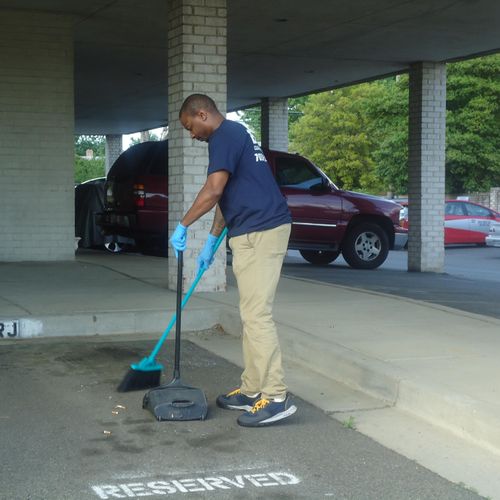 Cleaning all parking spaces of unwanted trash.