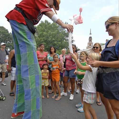 Walking stilts and twisting balloons at a festival