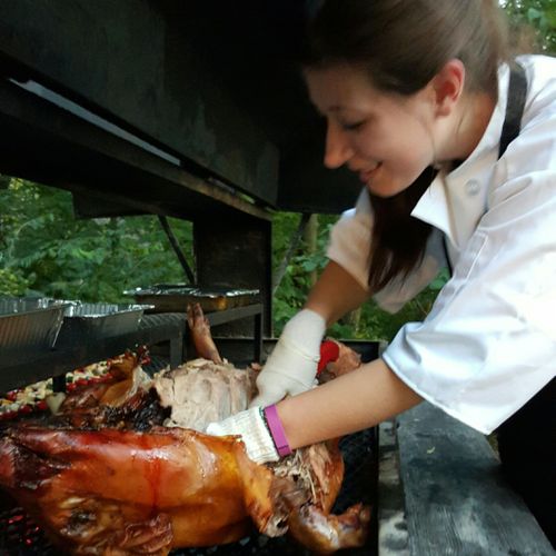 Chef Tiffany Carving for a Pig Roast