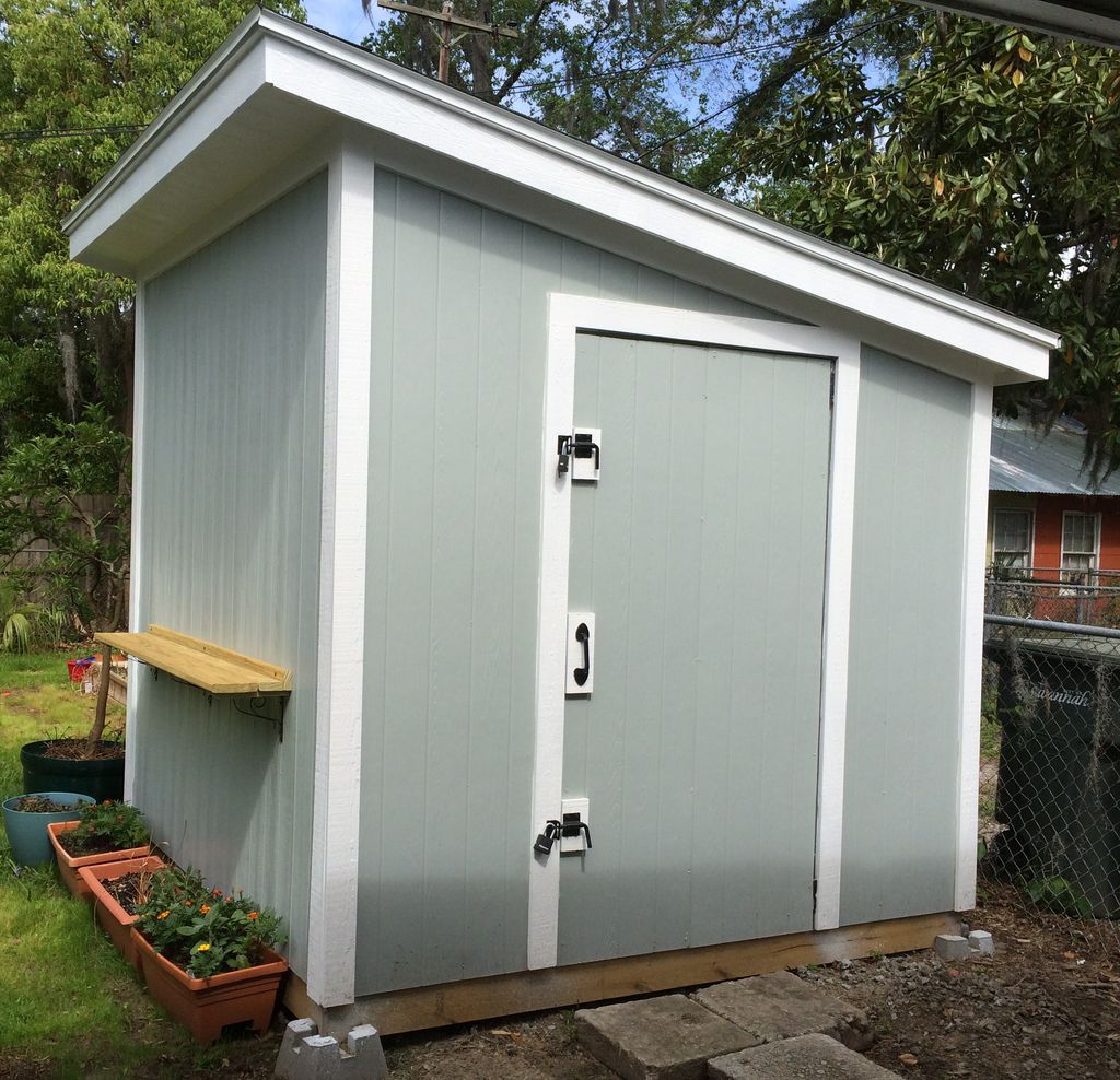 Finished shed with decorative shelf.