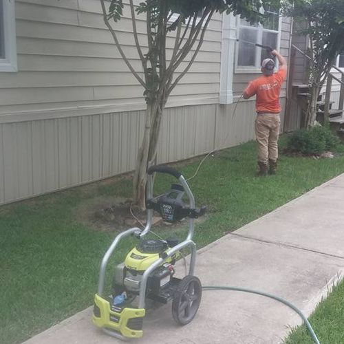 One of our workers pressure washing!