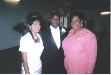 Angie w/ the bride and groom at their reception.