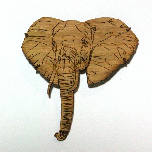 This elephant brooch is made out of bamboo. I desi