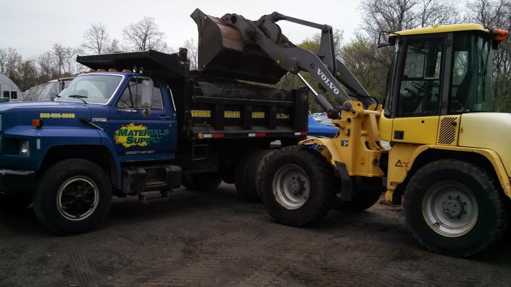 Volvo Loader loading Small Dump