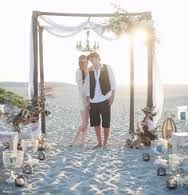 Happy couple after their beach ceremony