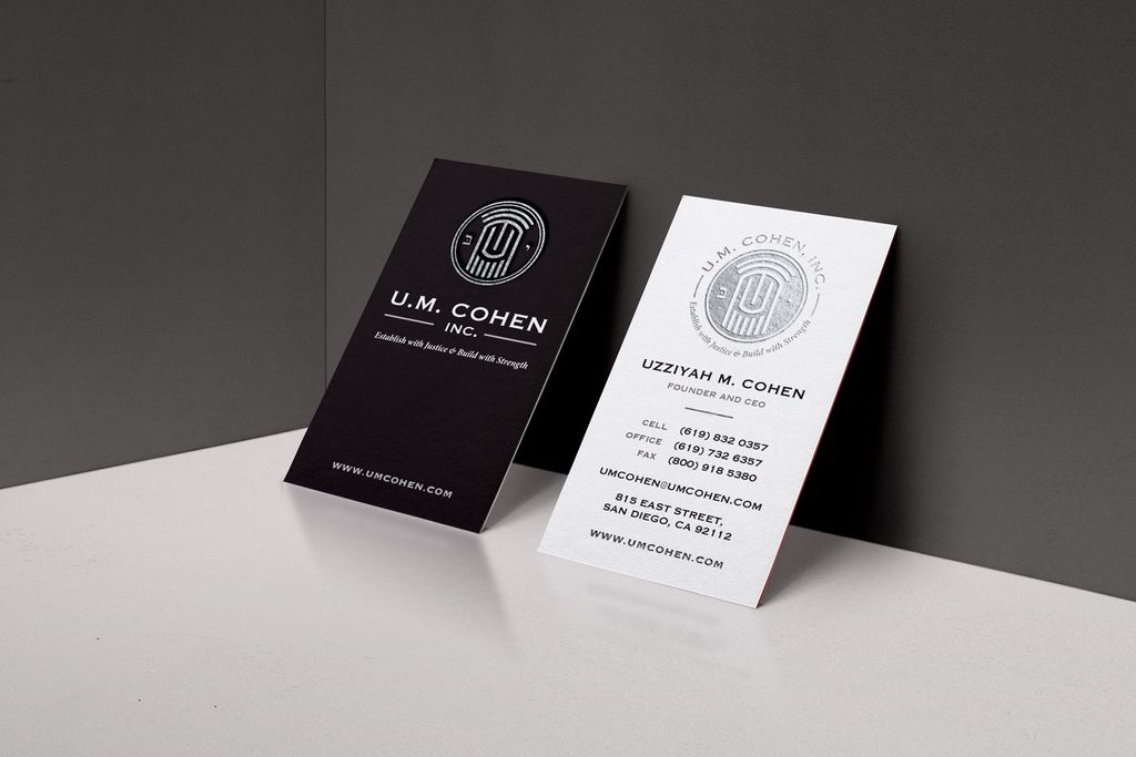 Matching business cards printed with silver foil.