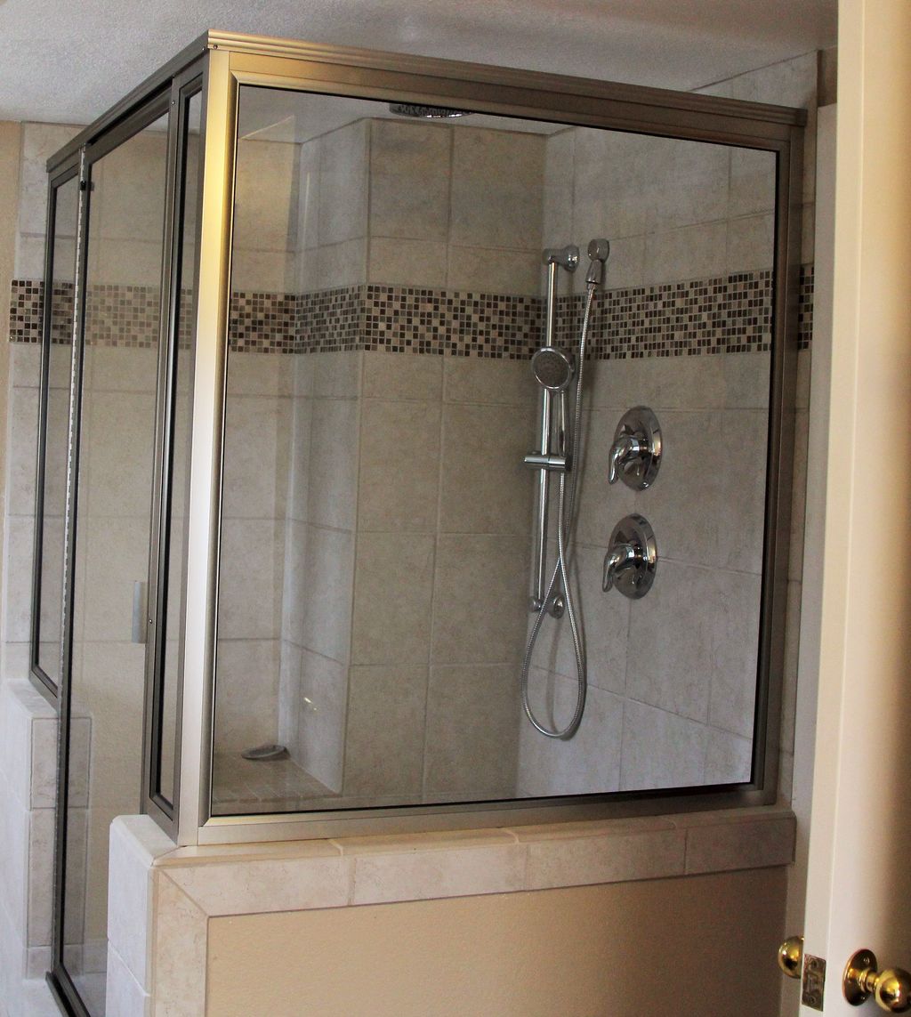 Completed shower with bench, hand held and rain he