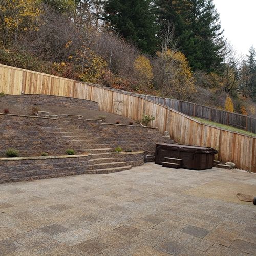 Two retaining walls and stairs leading up to upper