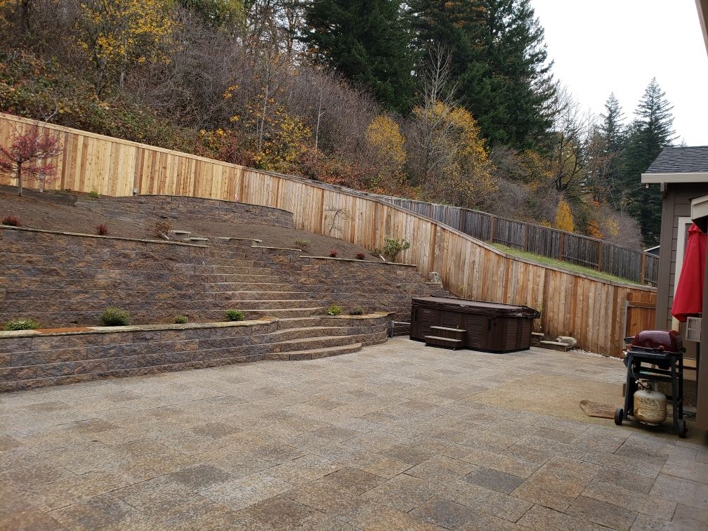 Two retaining walls and stairs leading up to upper