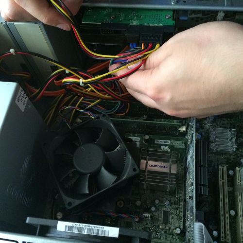 Close up of the process of removing a power supply