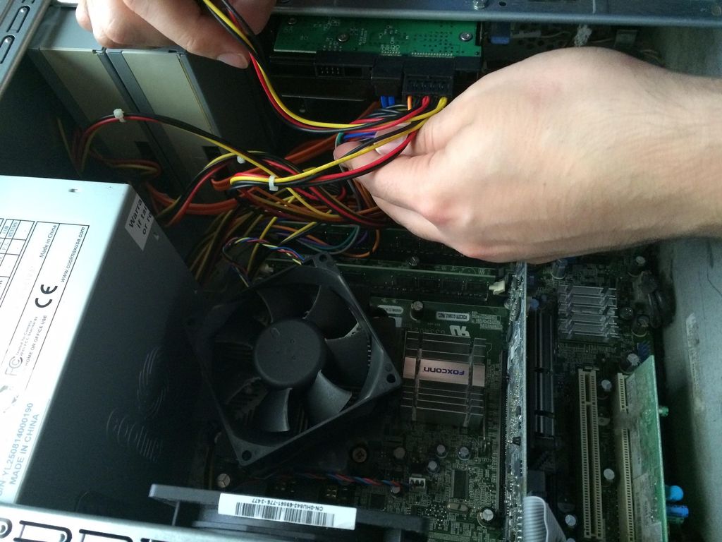 Close up of the process of removing a power supply